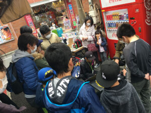 group of people watching beyblade match