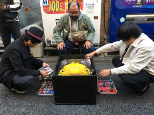 players at beyblade burst tournament prepare beyblades for 3on3 battle format match