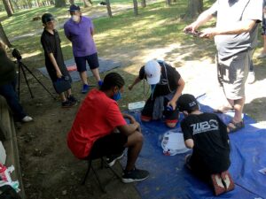beyblade tournament battle players launching in park