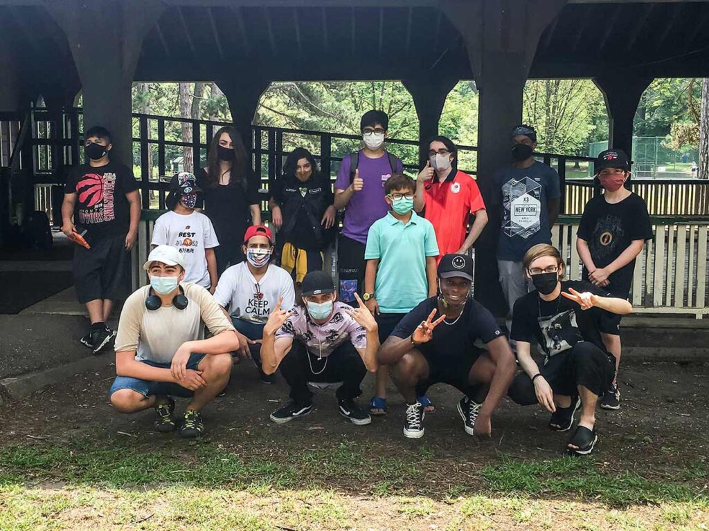 group photo outside covered area at park