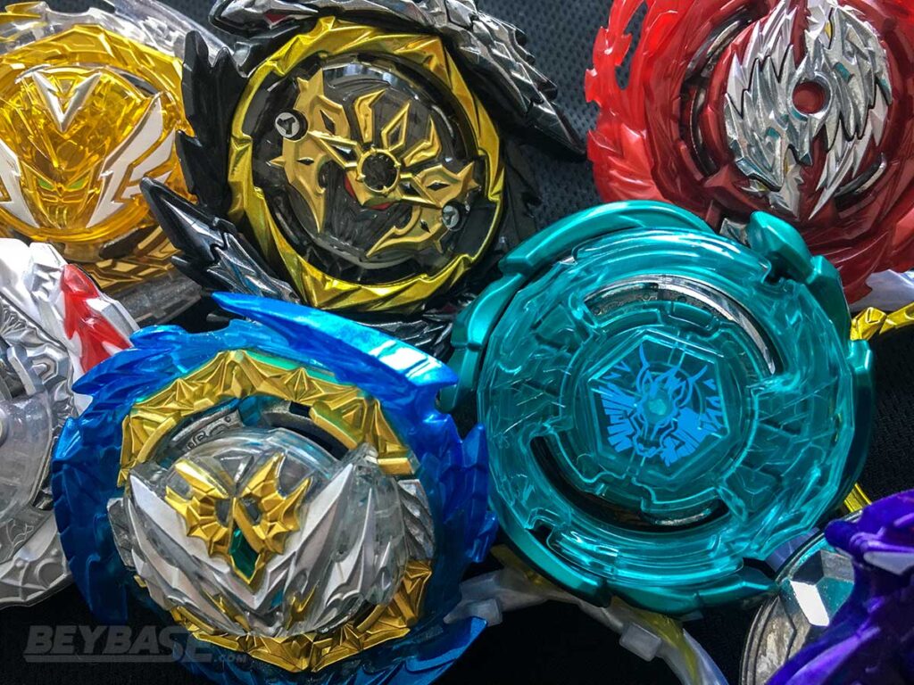 group of colourful beyblade burst parts