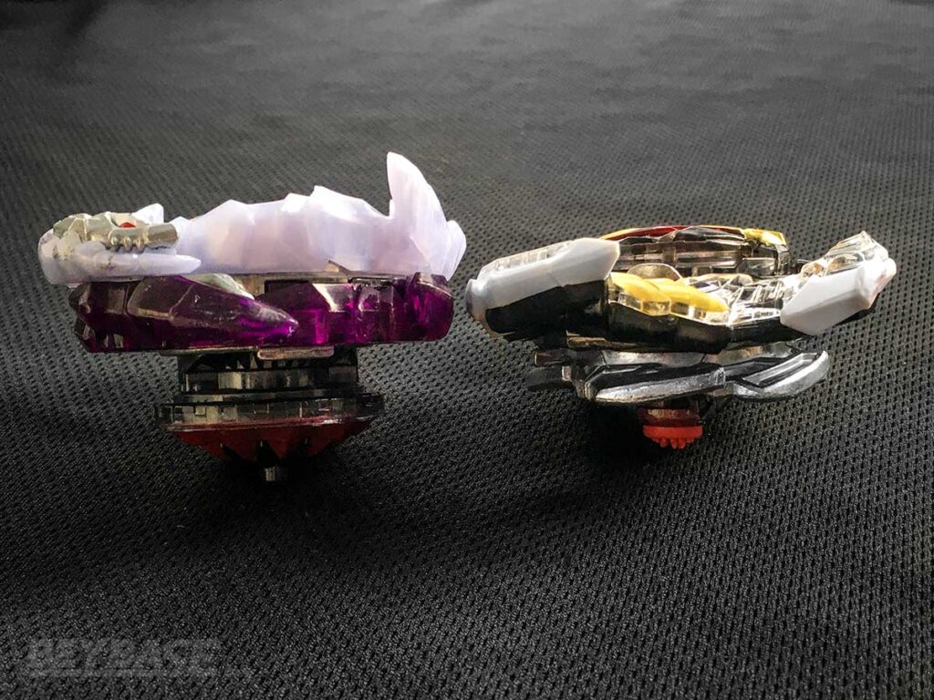 side view of two beyblades illustrating height difference